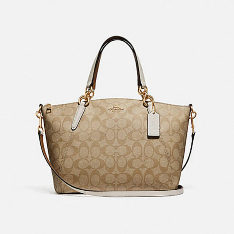 Coach Rogue bags with a monogram - embossed leather surfaceCoach Kelsey Satchel In Signature Canvas Bag