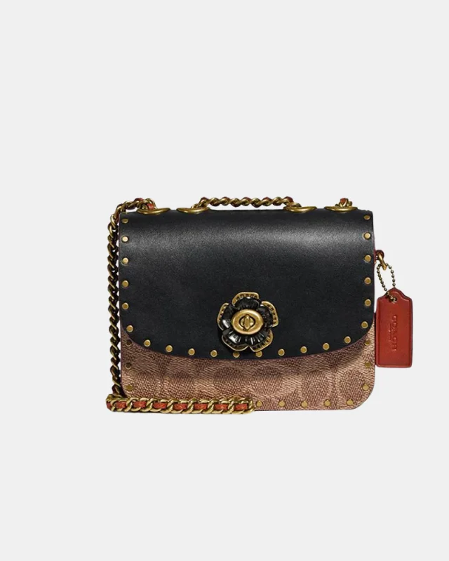 Coach Rogue bags featuring the signature C - hardware for a branded lookCoach Madison Shoulder Bag 16 In Signature Canvas With Rivets