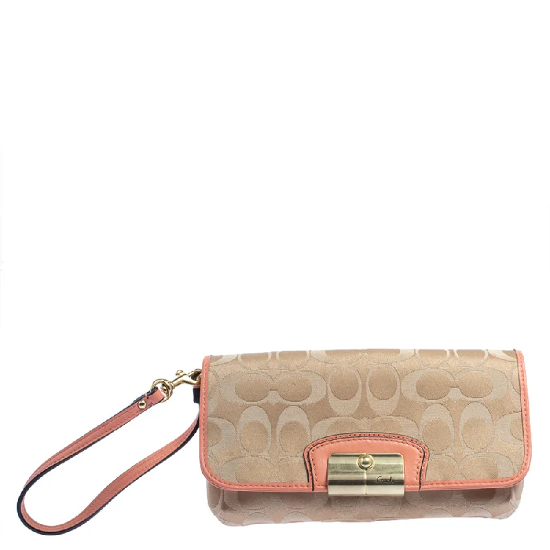 Coach crossbody bags with a printed floral pattern for a feminine touchBeige/Orange Signature Canvas and Leather Wristlet Clutch