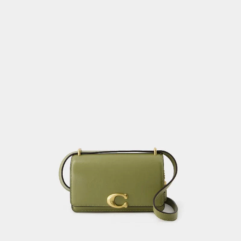 Coach tote bags with a snap - button closure and a decorative charm for styleBandit Crossbody - Coach - Leather - Khaki