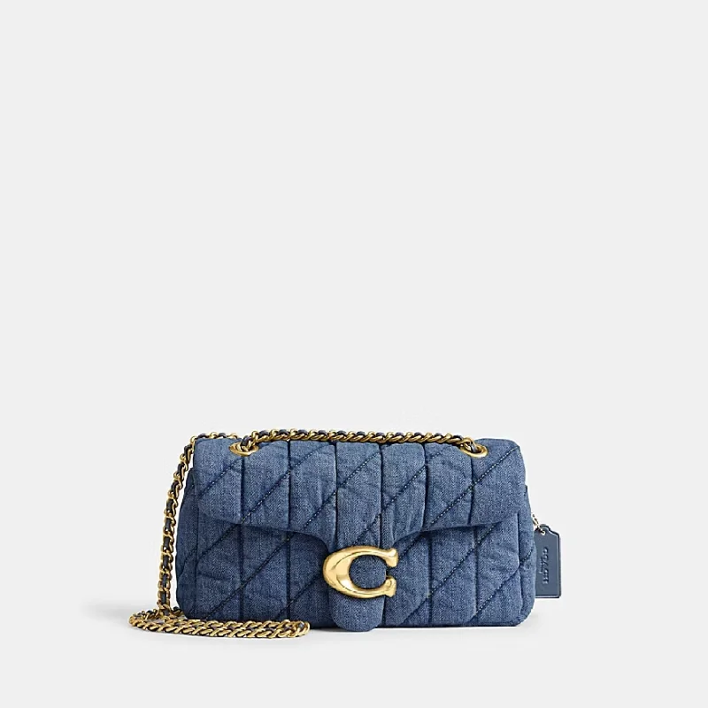 Coach Dempsey bags with a contrast - colored interior for visual interestTabby 26 Shoulder Bag - Coach - Denim - Blue