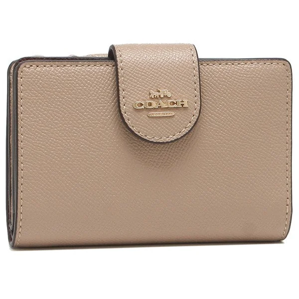 Ladies Coach Tabby bags with a textured leather surface for a more tactile lookCOACH 6390 Medium Corner Zip Wallet Collection