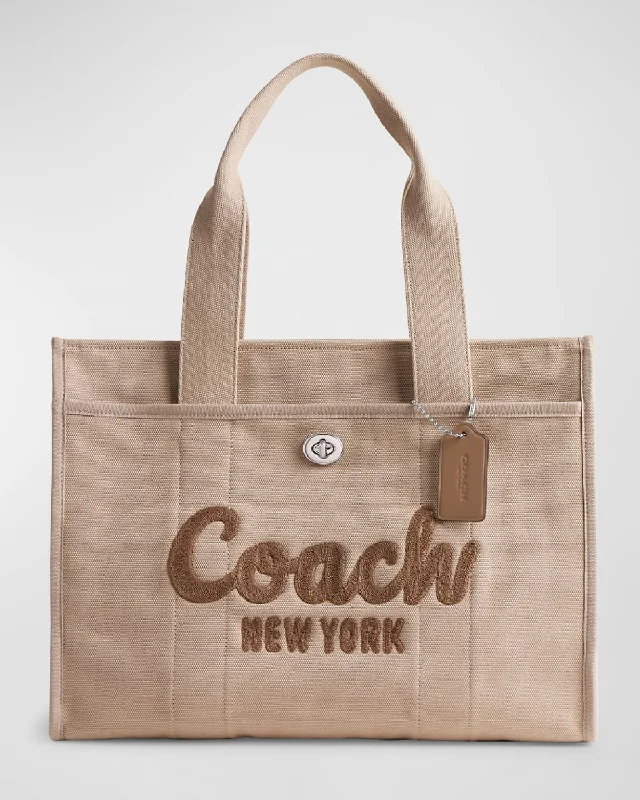 Coach tote bags with a snap - button closure and a decorative charm for styleLogo Canvas Cargo Tote Bag