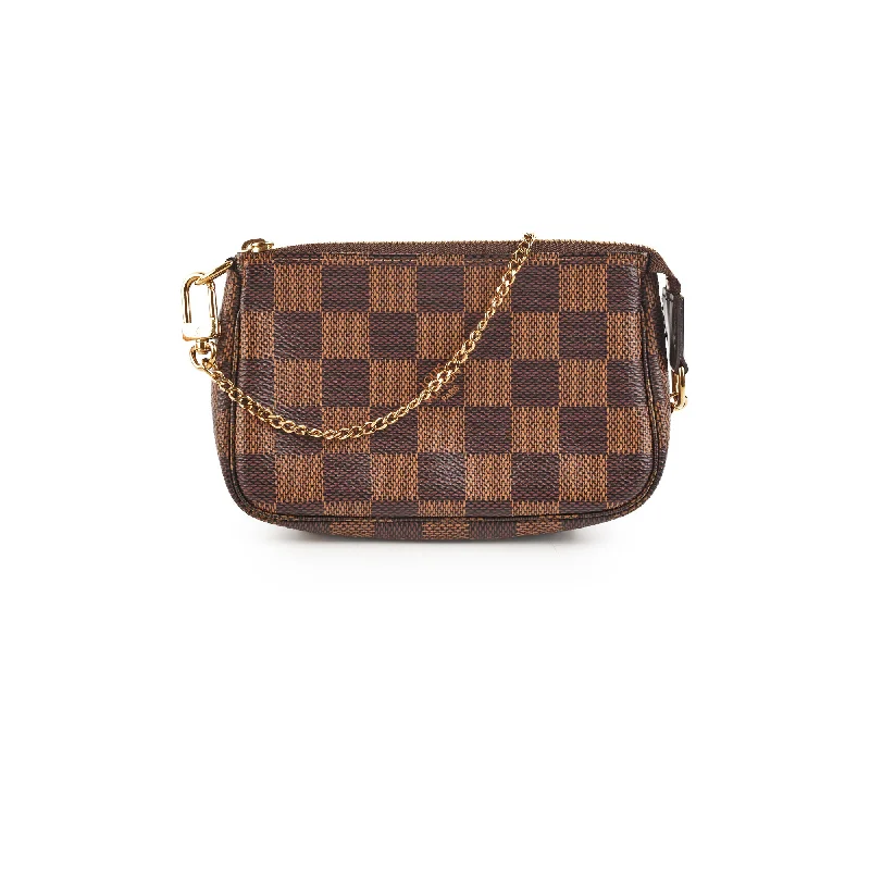 Louis Vuitton Twist bags with a crystal - embellished LV - turnlockLouis Vuitton Mini Pochette Accessories