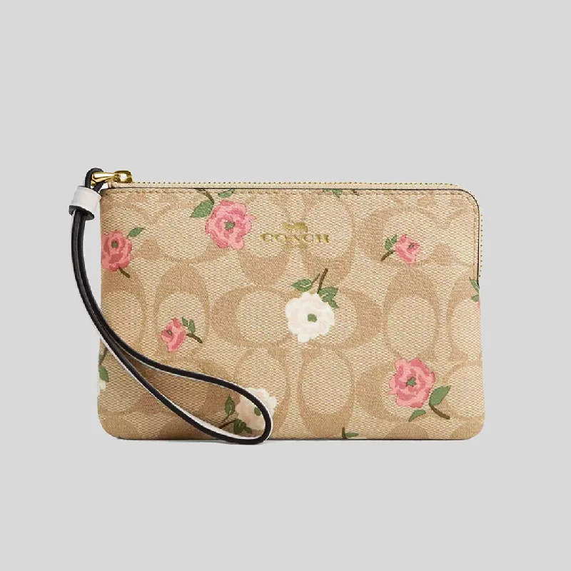 Coach Borough bags with a contrast - stitched handle for a unique lookCOACH Corner Zip Wristlet In Signature Canvas With Floral Print CR973