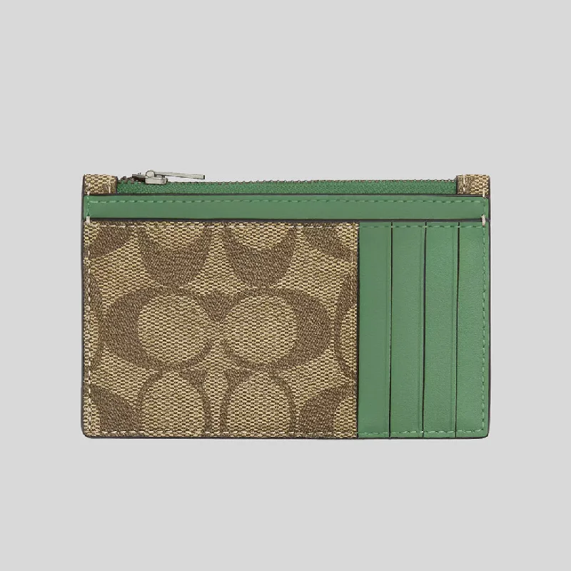 Coach Rogue bags with a monogram - embossed leather surfaceCOACH Zip Card Case In Signature Canvas Khaki/Soft Green C4281