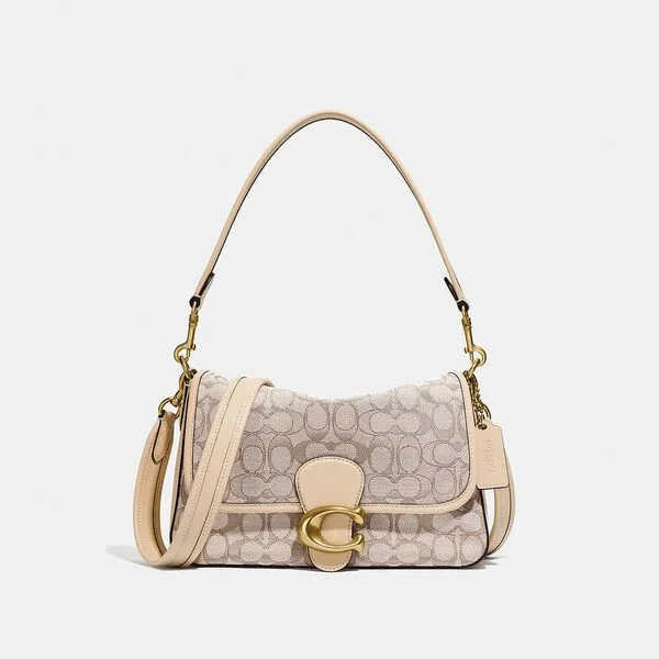 Coach Rogue bags featuring the signature C - hardware for a branded lookCoach Soft Tabby Shoulder Bag In Signature Jacquard