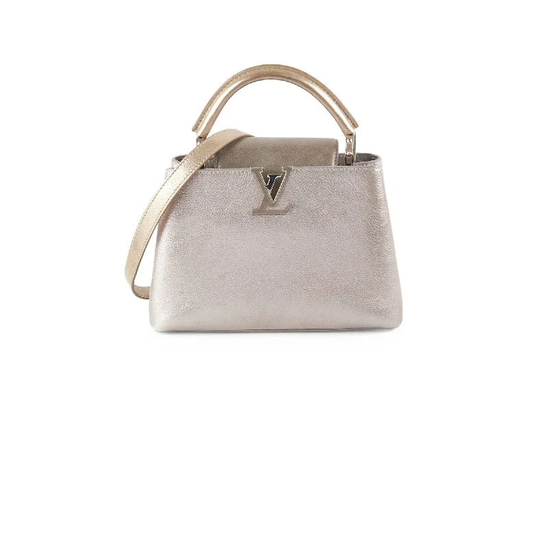 Ladies Louis Vuitton Petite Malle bags in a pastel color for a soft lookLouis Vuitton Capucines BB Tri Metallic