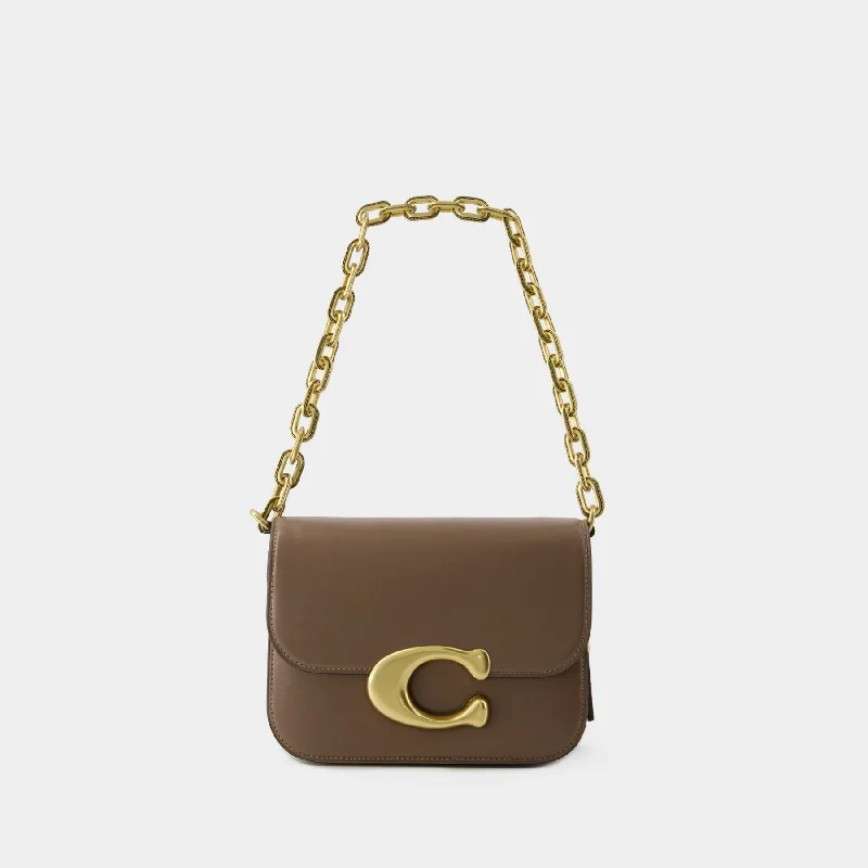 Coach Dempsey bags with a contrast - colored interior for visual interestIdol Crossbody - Coach - Leather - Dark Stone