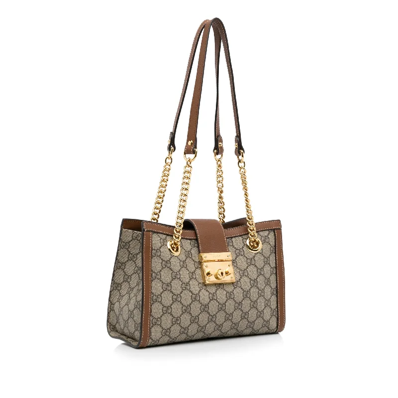 Women Gucci Sylvie bags with a monogram - embossed leatherBrown Gucci Small GG Supreme Padlock Tote