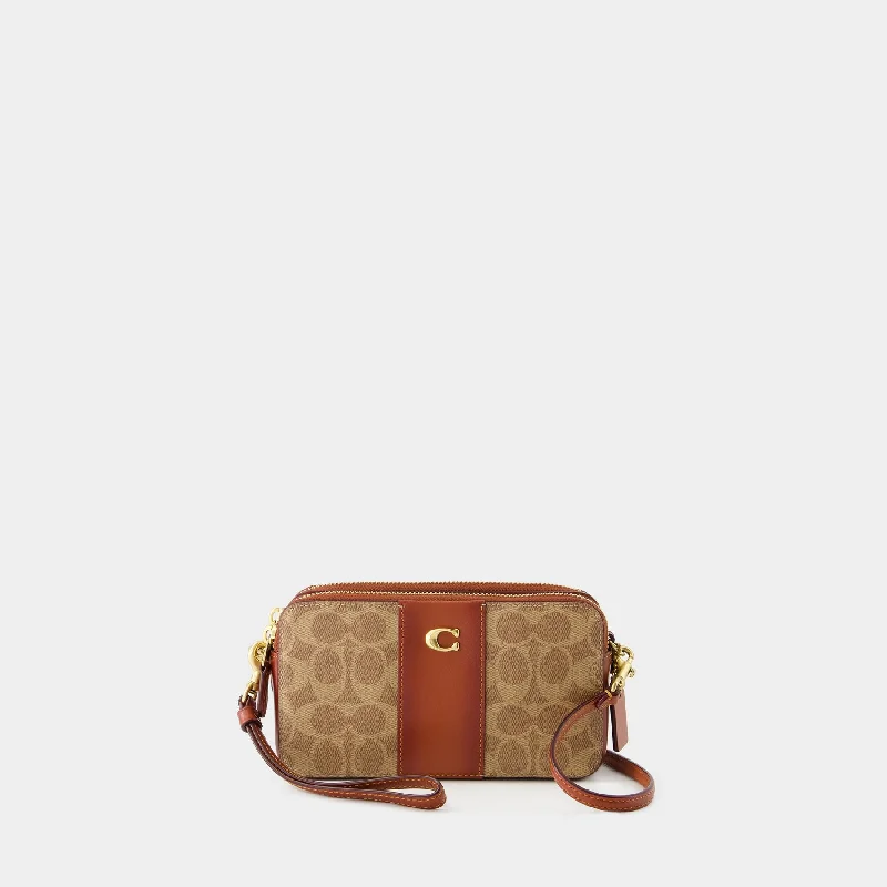 Coach Borough bags with a contrast - stitched handle for a unique lookKira Crossbody - Coach - Canvas - Tan Rust