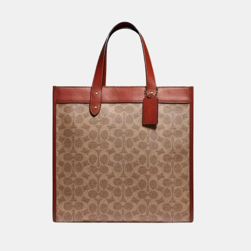 Coach bags with a patent - leather finish for a shiny and sophisticated appearanceCOACH FIELD TOTE IN SIGNATUE CANVAS WITH HORSE AND CARRIAGE PRINT