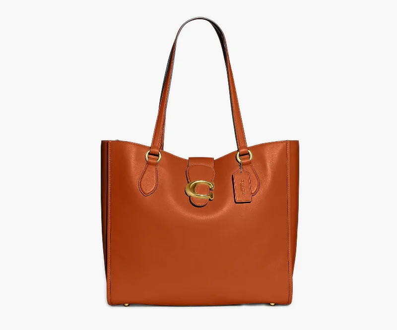 Coach tote bags with a printed Coach logo for brand visibilityCoach – Theo Tote Large