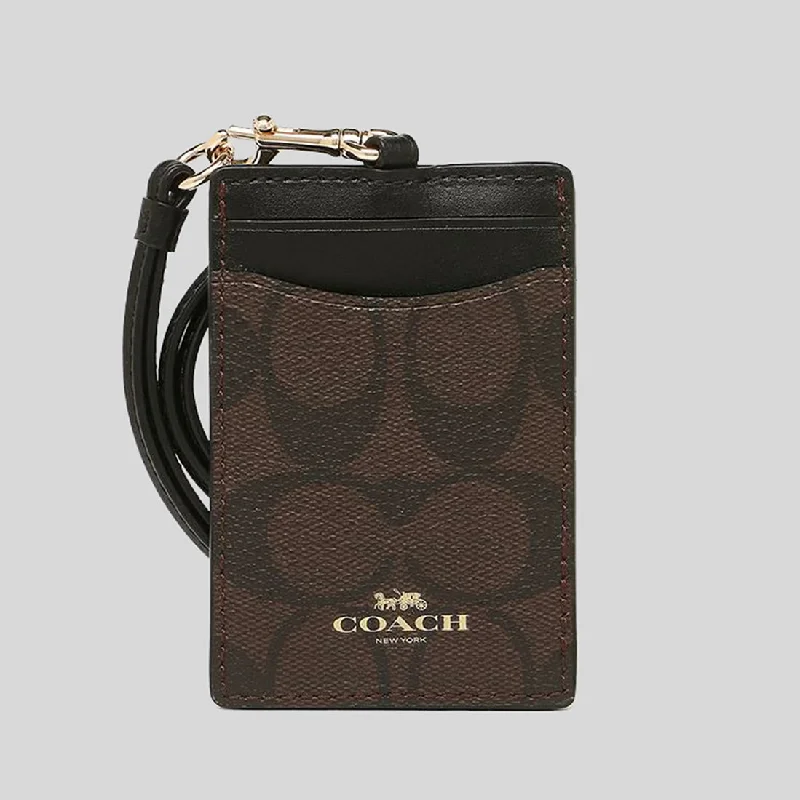 Coach Rogue bags featuring the signature C - hardware for a branded lookCOACH ID Lanyard In Signature Canvas Brown Black 63274