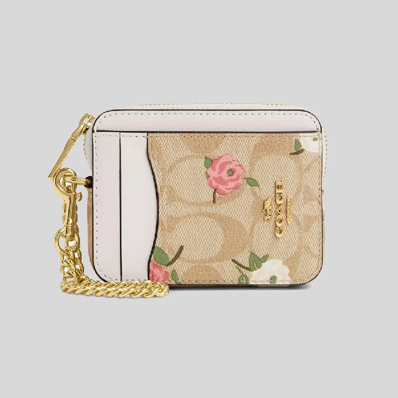 Coach Rogue bags with a detachable shoulder strap for versatile carryingCOACH Zip Card Case In Signature Canvas With Floral Print CR971