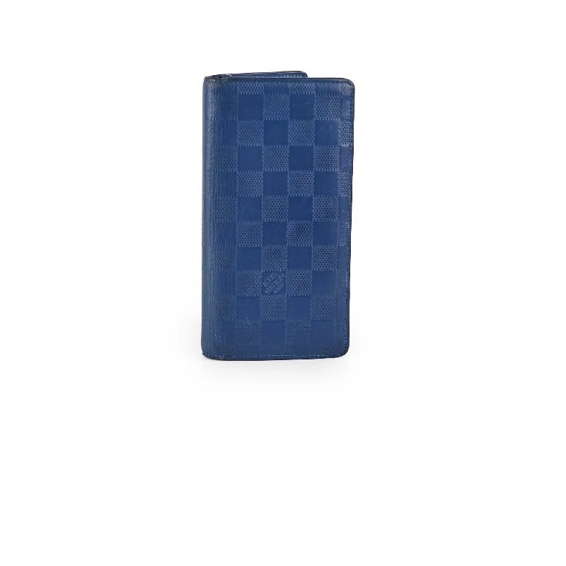 Ladies Louis Vuitton Capucines bags with gold - toned hardwareLouis Vuitton Long Blue Wallet