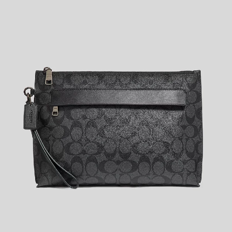 Small - sized Coach crossbody bags in smooth pebble leather for a compact carryCOACH Carryall Pouch In Signature Canvas Charcoal/Black 29508